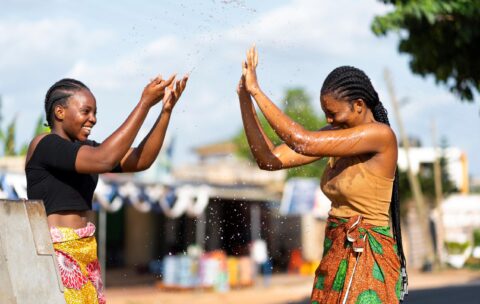 beautiful-african-women-having-fun-while-fetching-water