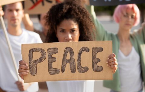 close-up-people-protesting-with-placards