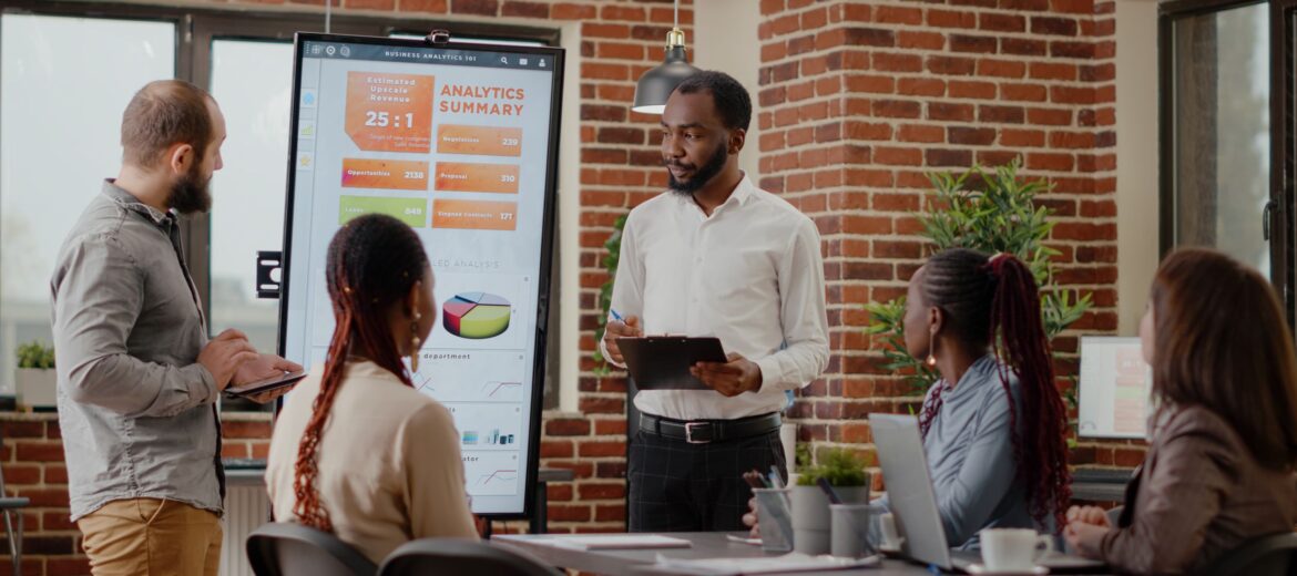 diverse-people-presenting-business-project-strategy-meeting-office-workmates-doing-financial-presentation-monitor-front-colleagues-working-development-growth