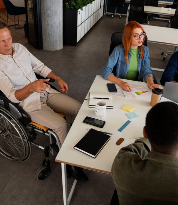 man-wheelchair-having-inclusive-office-job (1)