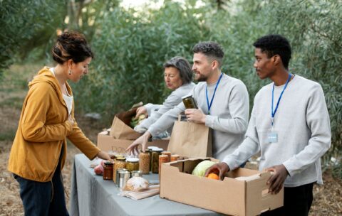 medium-shot-people-with-food-donations