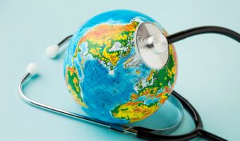 high-angle-globe-with-stethoscope-peace-day